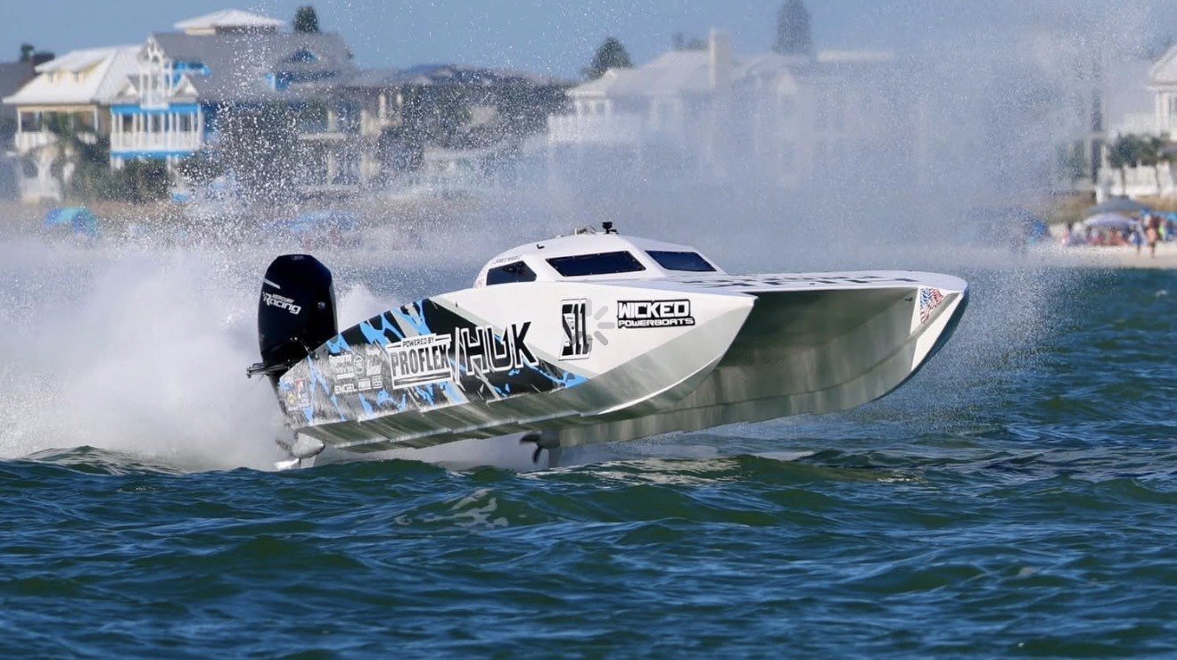 The HUK Racing S-11 Super Stock catamaran at speed